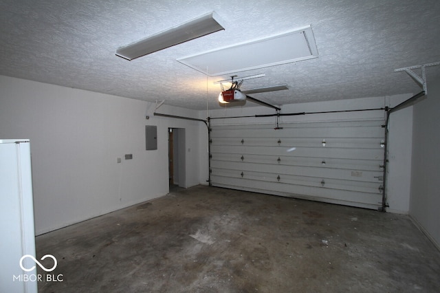 garage featuring a garage door opener, electric panel, and white fridge