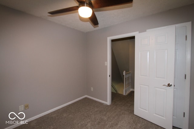 unfurnished bedroom with carpet flooring and ceiling fan