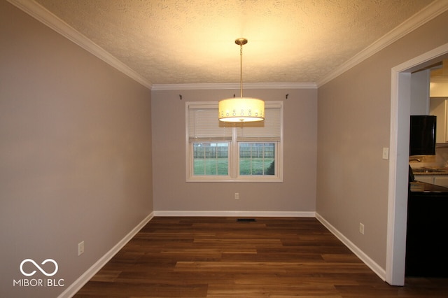 unfurnished dining area featuring a textured ceiling, dark hardwood / wood-style floors, and crown molding