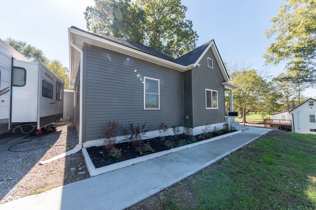 view of home's exterior with a yard