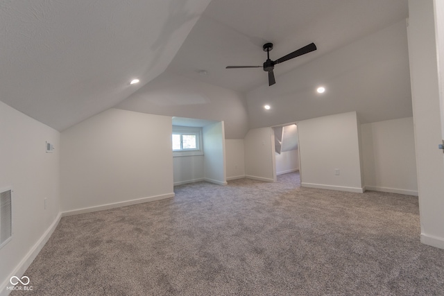 bonus room with ceiling fan, carpet flooring, and vaulted ceiling