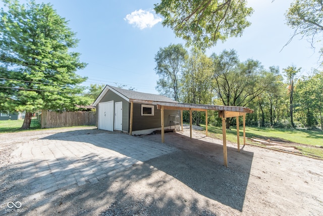 exterior space with a storage shed and a carport