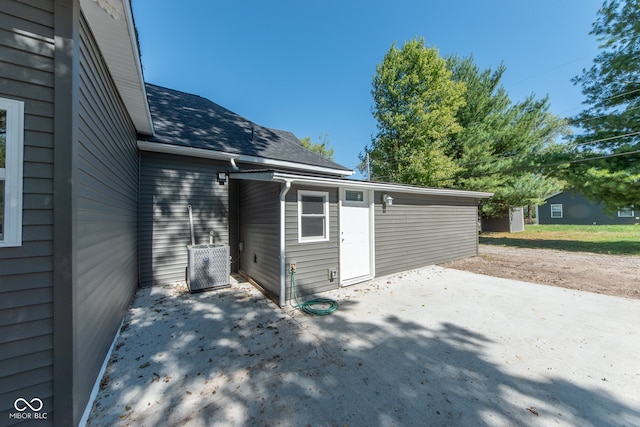 exterior space with a patio and cooling unit