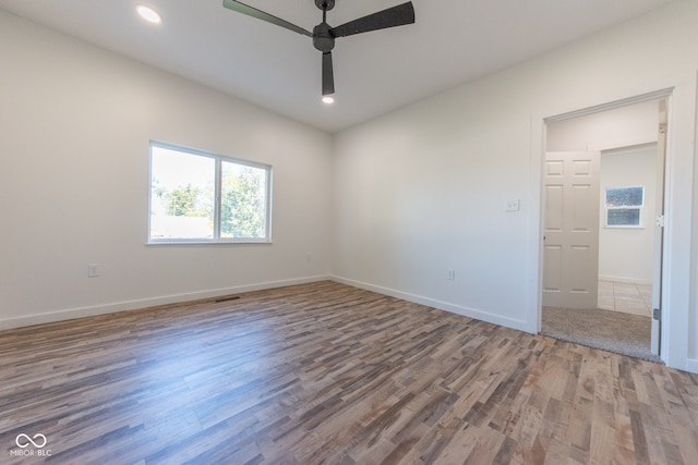 unfurnished room featuring wood-type flooring and ceiling fan