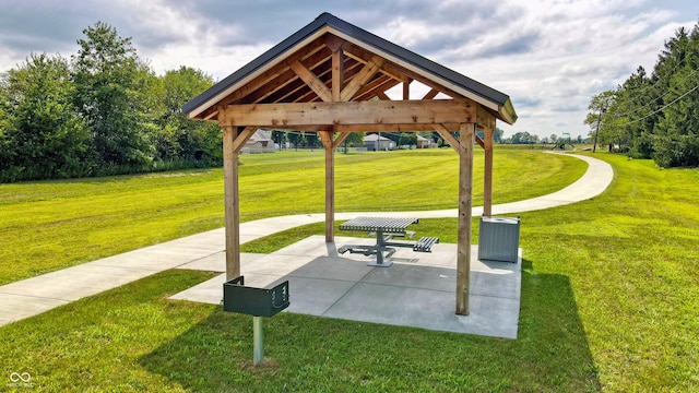 surrounding community featuring a lawn, a gazebo, and a patio area
