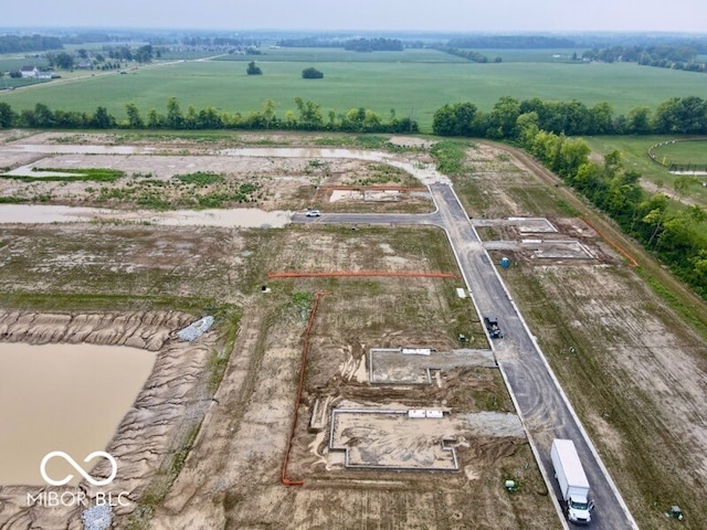 birds eye view of property with a rural view