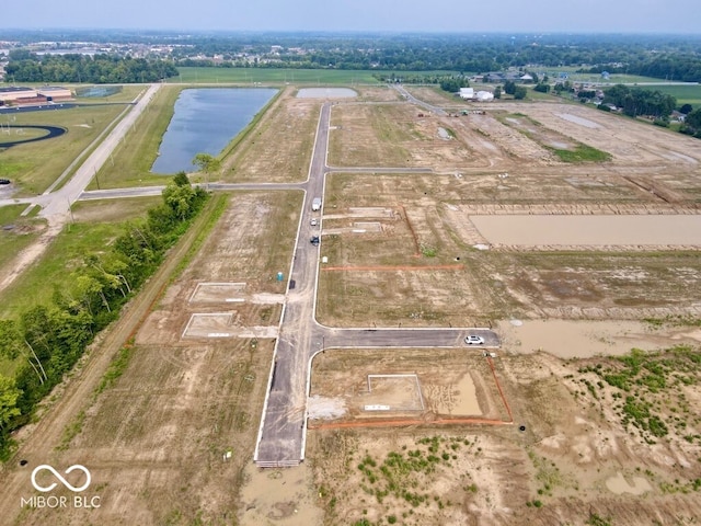 birds eye view of property featuring a rural view and a water view