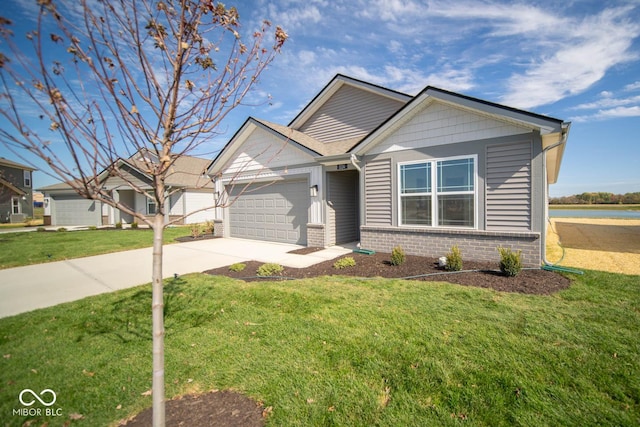 view of front of home featuring a front yard, driveway, a garage, and brick siding