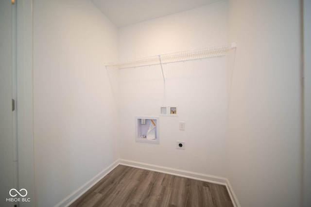 clothes washing area featuring washer hookup, laundry area, dark wood-type flooring, electric dryer hookup, and baseboards