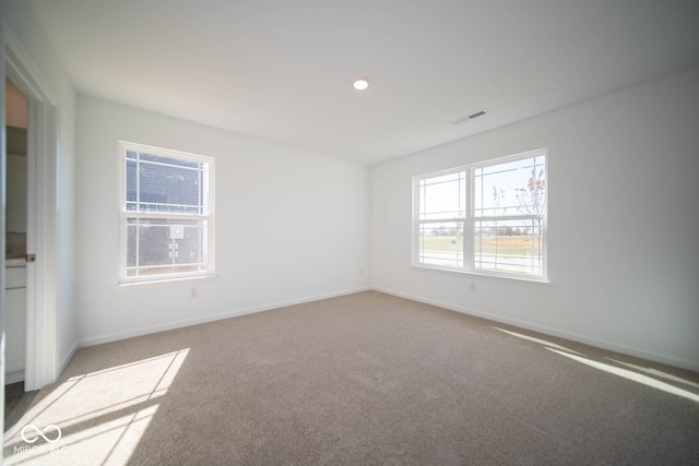 unfurnished room featuring carpet floors