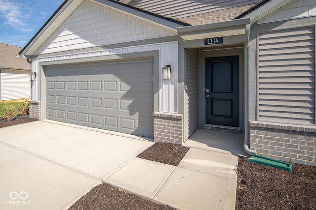 doorway to property featuring a garage