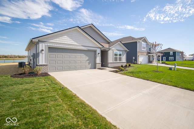 view of front of house with brick siding, a front lawn, central AC unit, and driveway