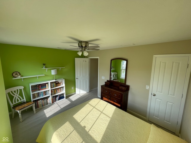 carpeted bedroom with ceiling fan