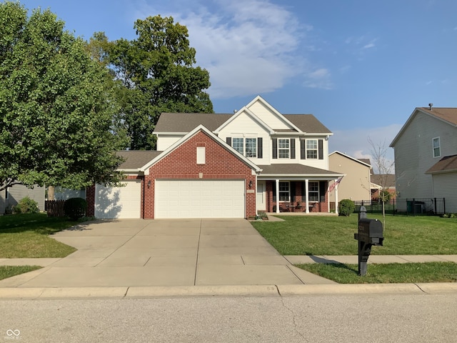 view of front of home with a porch, a garage, and a front lawn