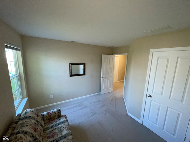 interior space featuring light colored carpet