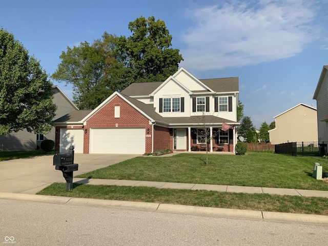 view of front of property with a garage and a front lawn