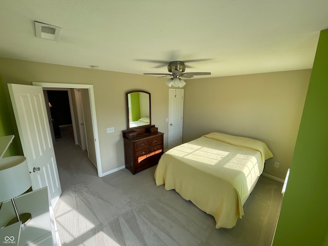 carpeted bedroom with ceiling fan