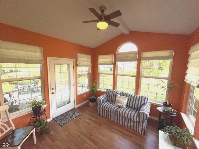 living room featuring dark hardwood / wood-style flooring, vaulted ceiling with beams, and ceiling fan