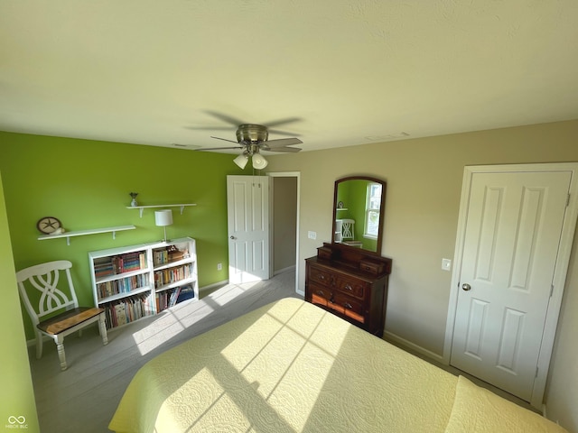 carpeted bedroom featuring ceiling fan