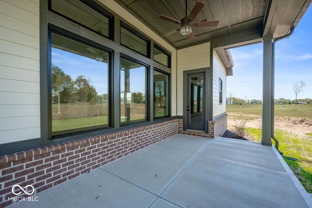 view of patio featuring ceiling fan