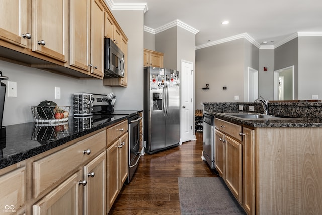 kitchen with dark stone countertops, ornamental molding, appliances with stainless steel finishes, and dark wood-type flooring