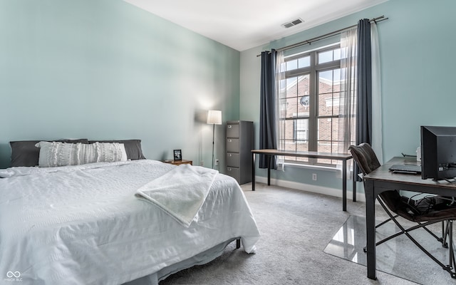 bedroom with light colored carpet