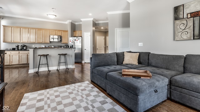 living room with dark hardwood / wood-style floors and crown molding