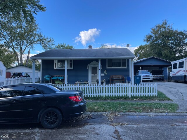 view of front of property featuring a carport