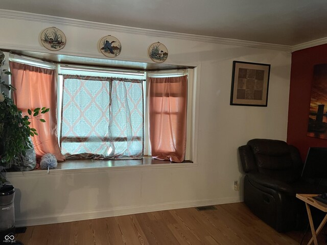 3991 Bennett Dr, Indianapolis, IN 46254 - living area with wood finished floors, ornamental molding, and baseboards