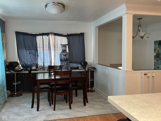 dining room with crown molding and hardwood / wood-style flooring