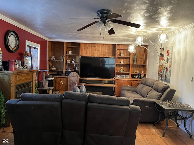 3991 Bennett Dr, Indianapolis, IN 46254 - living room featuring a ceiling fan, light wood finished floors, a fireplace, and ornamental molding