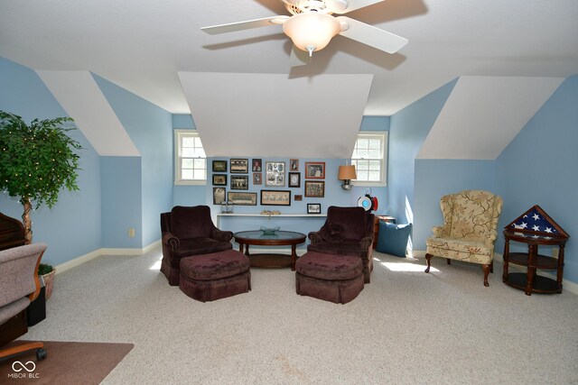 sitting room with carpet floors, lofted ceiling, and plenty of natural light
