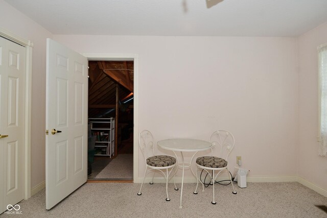 dining area with carpet flooring and baseboards
