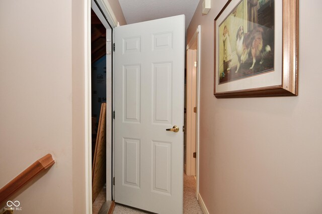 hallway featuring baseboards