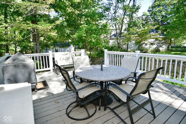 deck featuring outdoor dining area