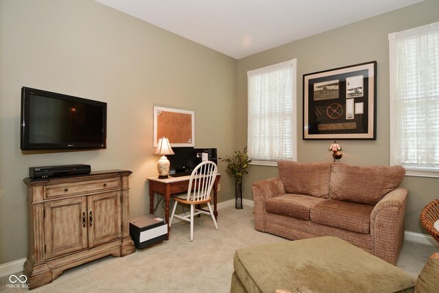 home office featuring light colored carpet and baseboards