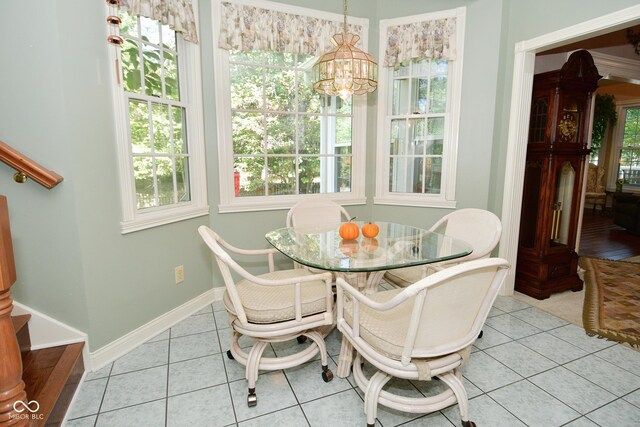 dining room with stairway, an inviting chandelier, tile patterned flooring, and baseboards
