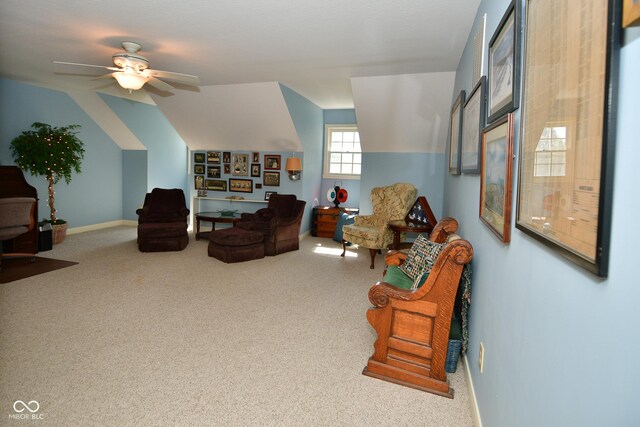 living room featuring baseboards, a ceiling fan, and carpet flooring