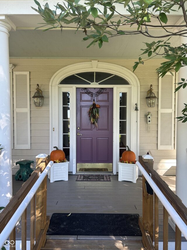 doorway to property featuring a porch