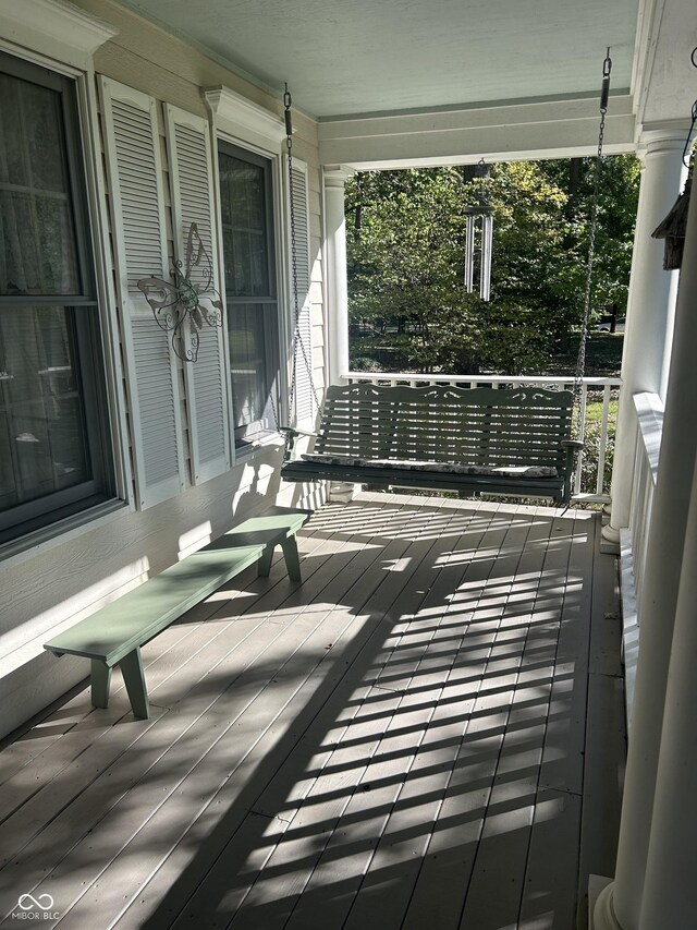 wooden terrace with a porch