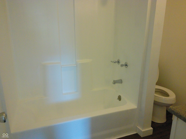 full bathroom featuring wood-type flooring, vanity, toilet, and shower / bath combination