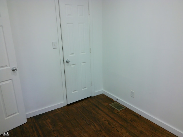 empty room featuring dark hardwood / wood-style floors