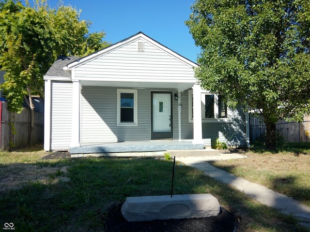 bungalow-style house with a front yard