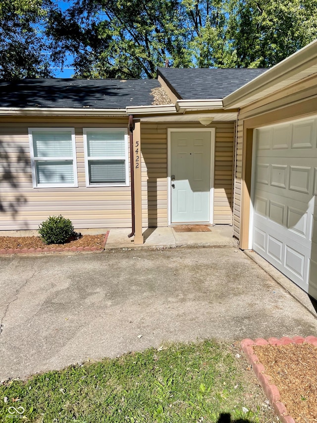 view of exterior entry featuring a garage