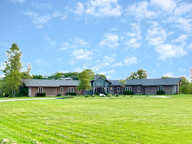 ranch-style house with a front lawn