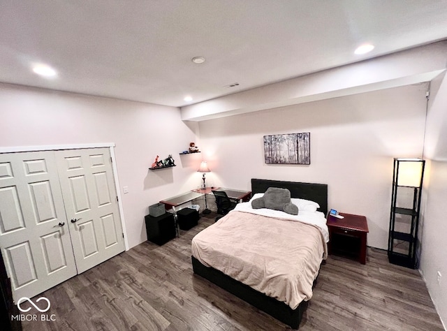 bedroom featuring a closet and hardwood / wood-style floors