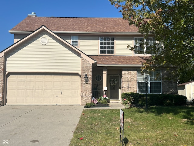 view of front property with a garage and a front lawn