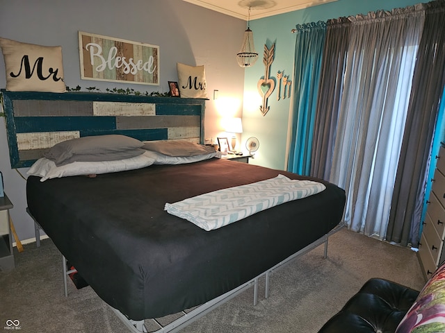 bedroom featuring crown molding and carpet flooring