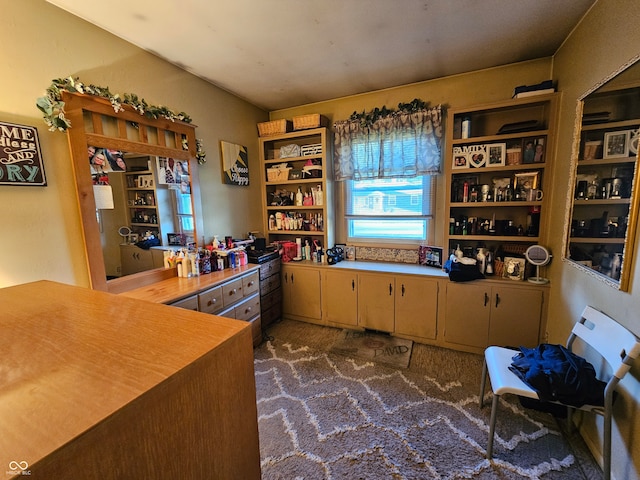 kitchen featuring dark colored carpet