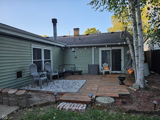 rear view of property with a wooden deck